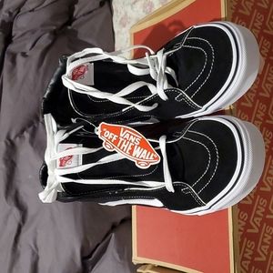 Men's shoes. Vans black and white sneakers.